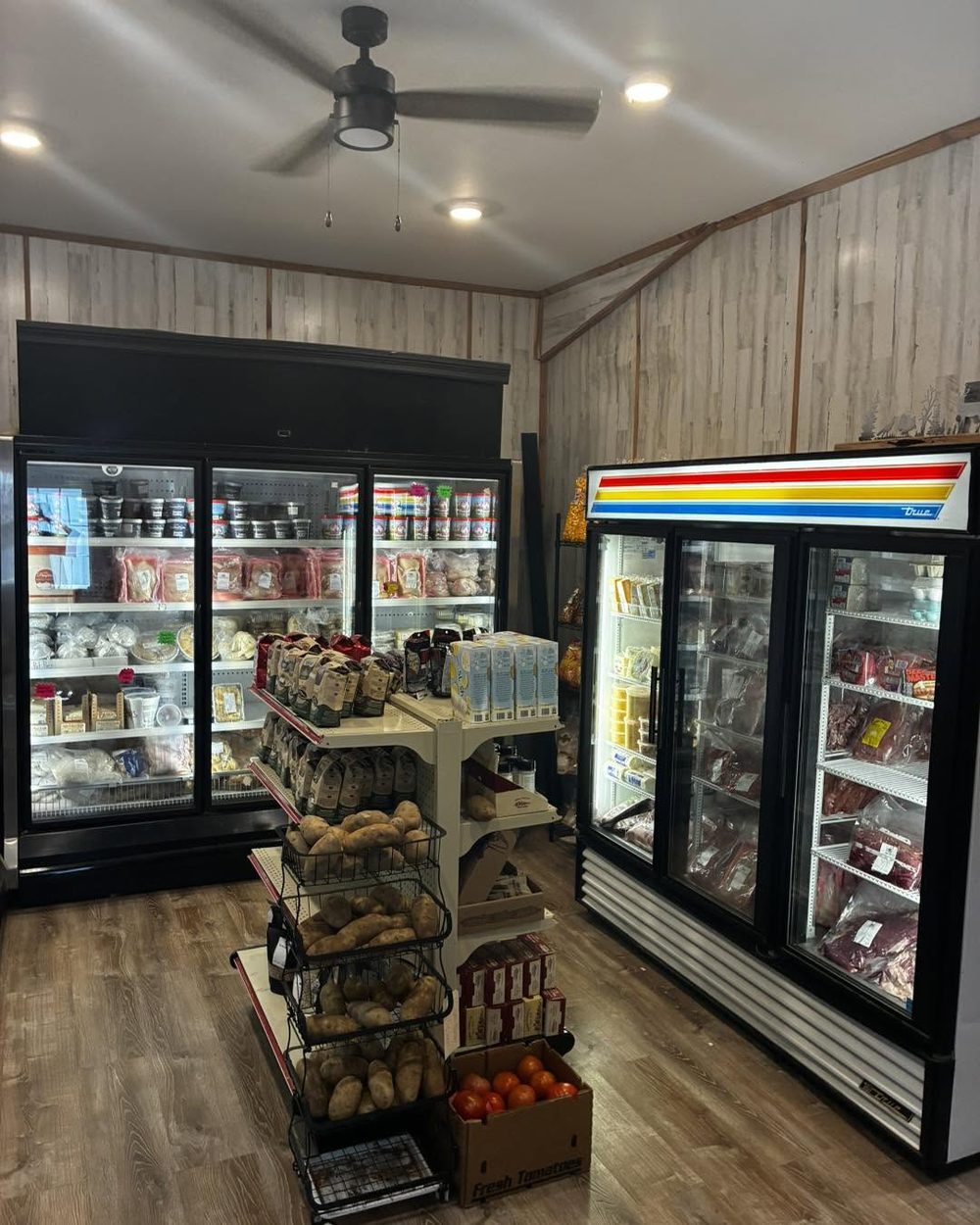 Inside the Farmington Meat retail store — coolers stocked with fresh meats and North Carolina products